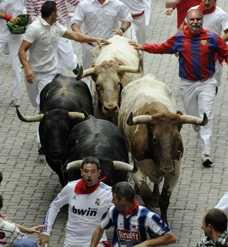 Tom runs with the bull